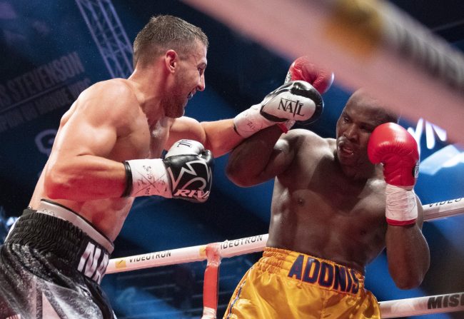 Oleksandr Gvozdyk forces Adonis Stevenson in the corner during their WBC light heavyweight championship fight in Quebec City, Dec. 1, 2018.