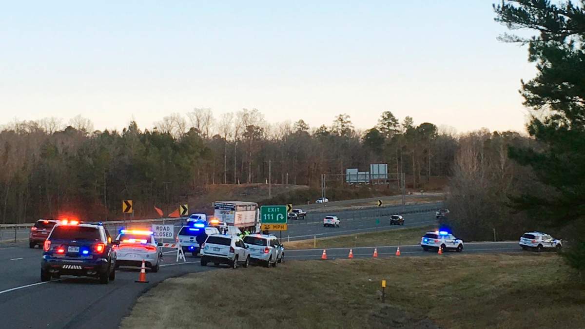 Emergency vehicles are parked along Interstate 30 near the scene where a charter bus that was carrying a youth football team from Tennessee crashed early. Photo: Josh Snyder/The Arkansas Democrat-Gazette via AP