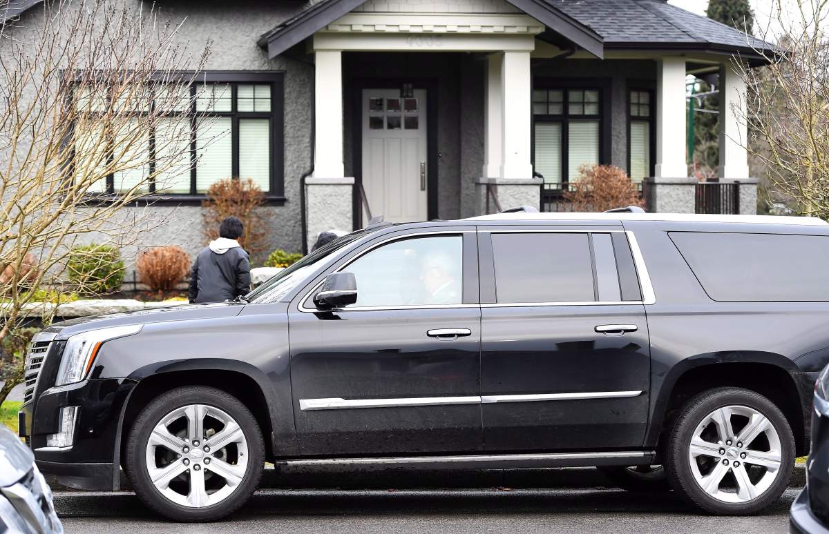 A vehicle is seen outside of Huawei CFO Meng Wanzhou’s home in Vancouver on Wednesday, Dec. 12, 2018. THE CANADIAN PRESS/Jonathan Hayward