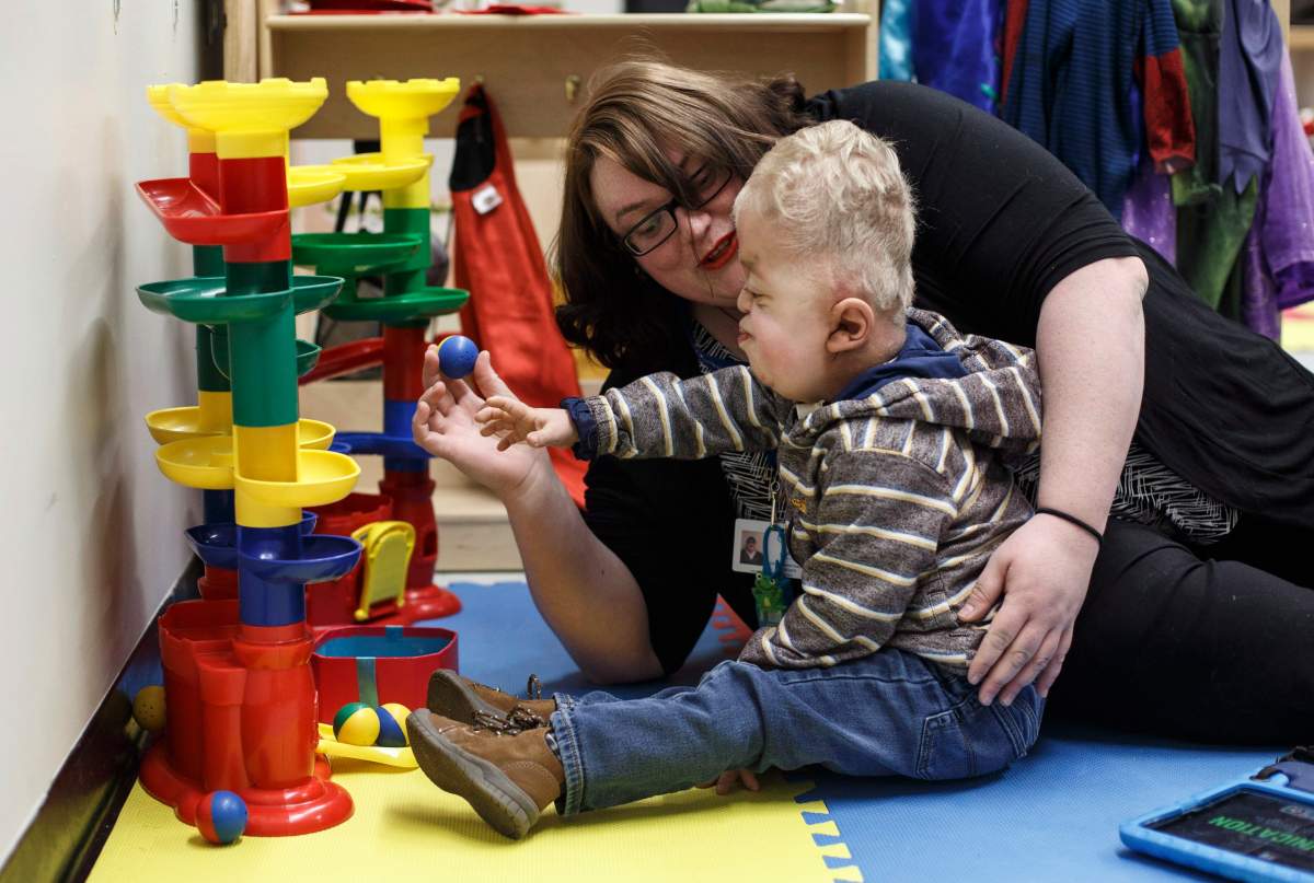 Developmental assistant Kate Jolicoeur, plays with Porter Stanley at preschool in Onoway, Alta., on Wednesday, November 7, 2018.