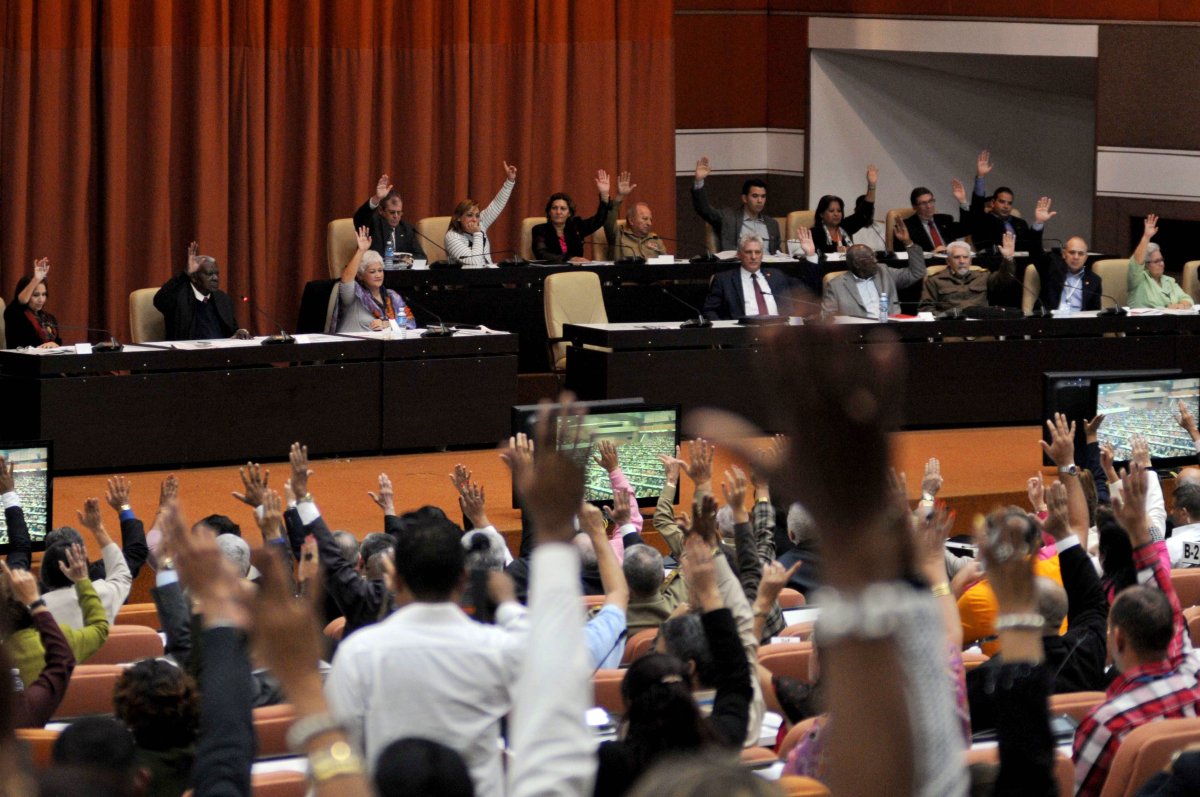 Deputies of the National Assembly of Cuba exercise their right to vote during the plenary session held at the Parliament, in Havana, Cuba, 22 December 2018.