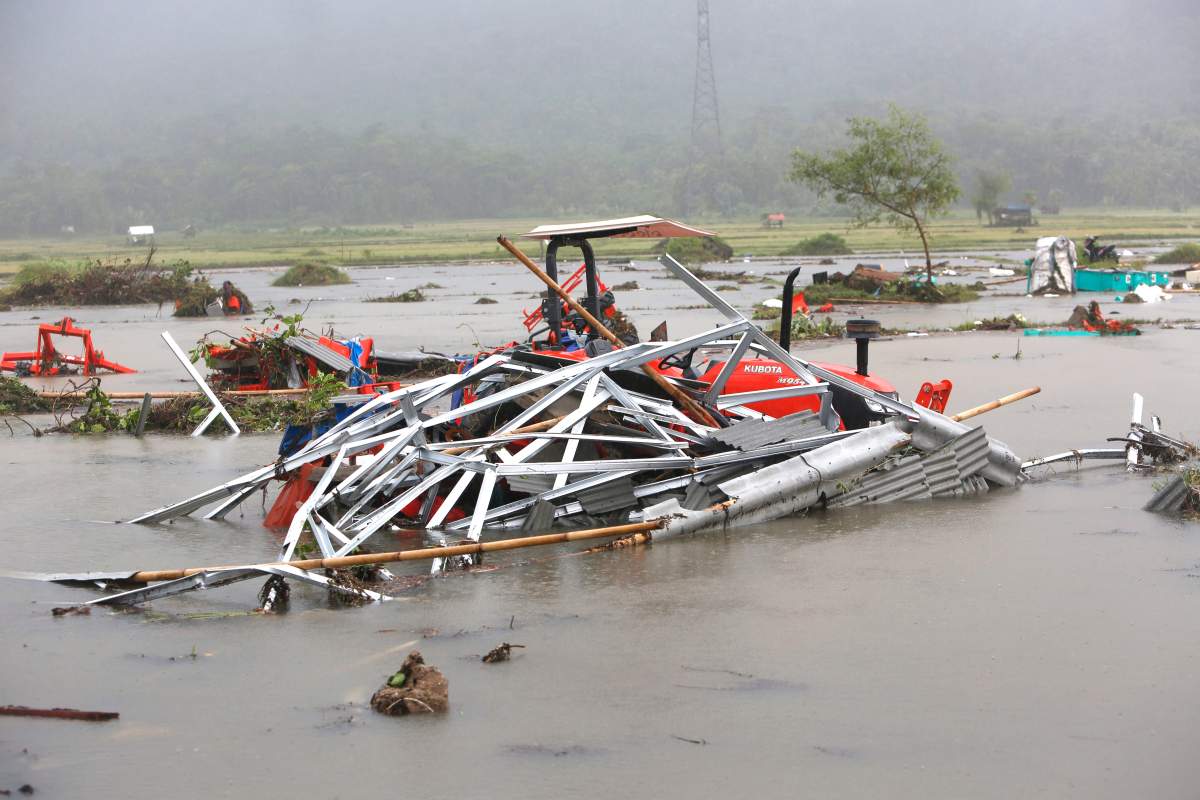 A ruined tractor sits in the water after a tsunami hit Sunda Strait in Anyer, Banten, Indonesia, Dec. 23, 2018.
