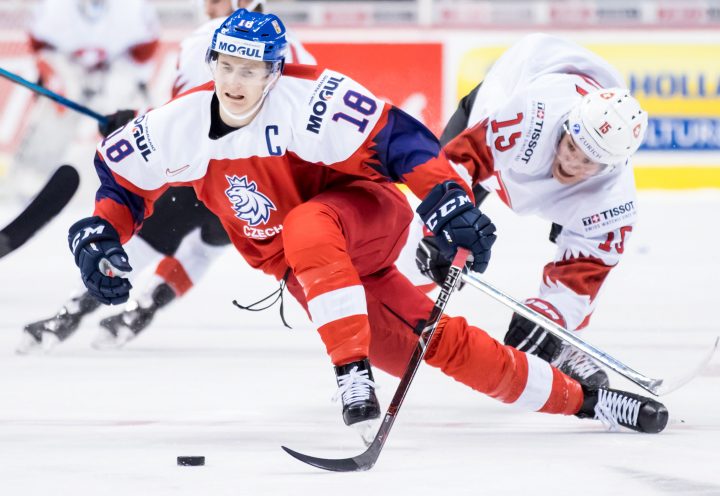 Czech Republic’s Martin Necas (18) and Switzerland’s Matthew Verboon (15) collide during first period World Junior Hockey Championship action in Vancouver on Wednesday, Dec. 26, 2018.