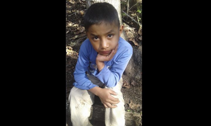 This Dec, 12, 2018 photo provided by Catarina Gomez on Thursday, Dec. 27, 2018, shows her half-brother Felipe Gomez Alonzo, 8, near her home in Yalambojoch, Guatemala.