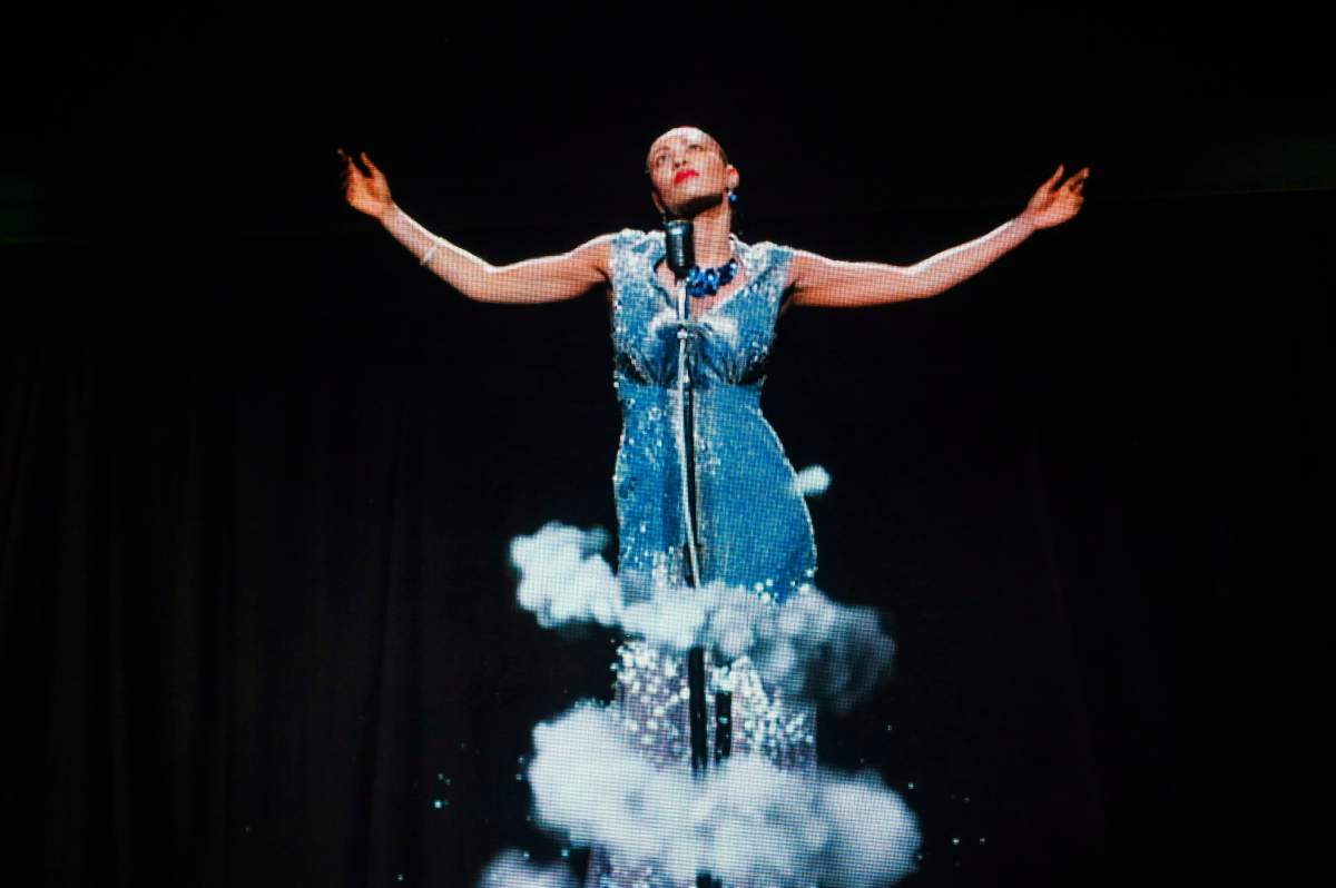 A hologram of Billie Holiday is projected for a crowd during a festival at Dundas Square in Toronto on June 8, 2018.
