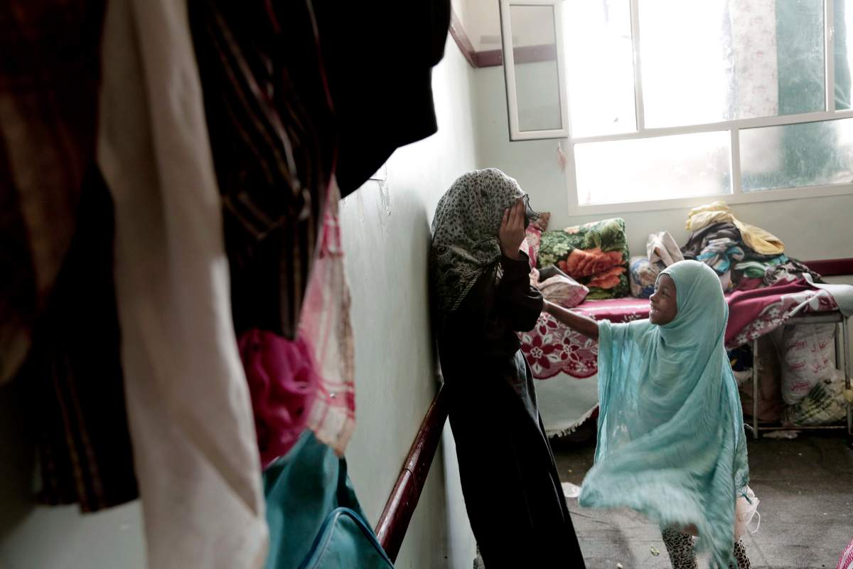 Sisters play in their room at a shelter for displaced persons in Ibb, Yemen in this Aug. 3, 2018, photo.