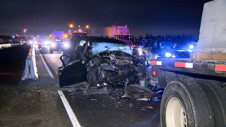 A minivan reportedly crashed into a truck while on Highway 401 near Trafalgar Road, leaving two people seriously injured. 