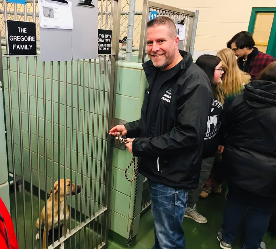 Winnipeg Animal Services’ Leland Gordon stands outside the kennel of one of the dogs at the shelter,