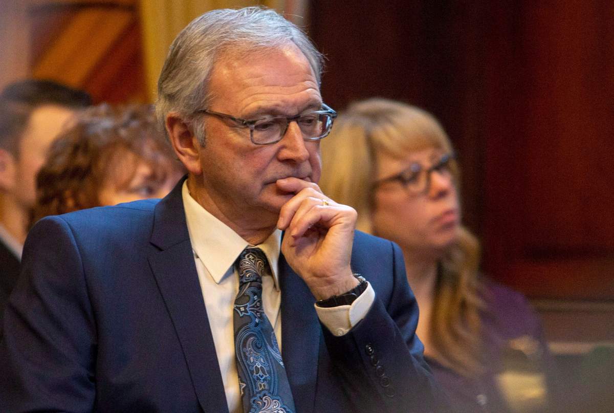 New Brunswick Premier Blaine Higgs listens on as Lieutenant Governor Jocelyne Roy Vienneau reads his government’s Throne Speech at the New Brunswick Legislature in Fredericton, N.B., on Tuesday, Nov. 20, 2018.