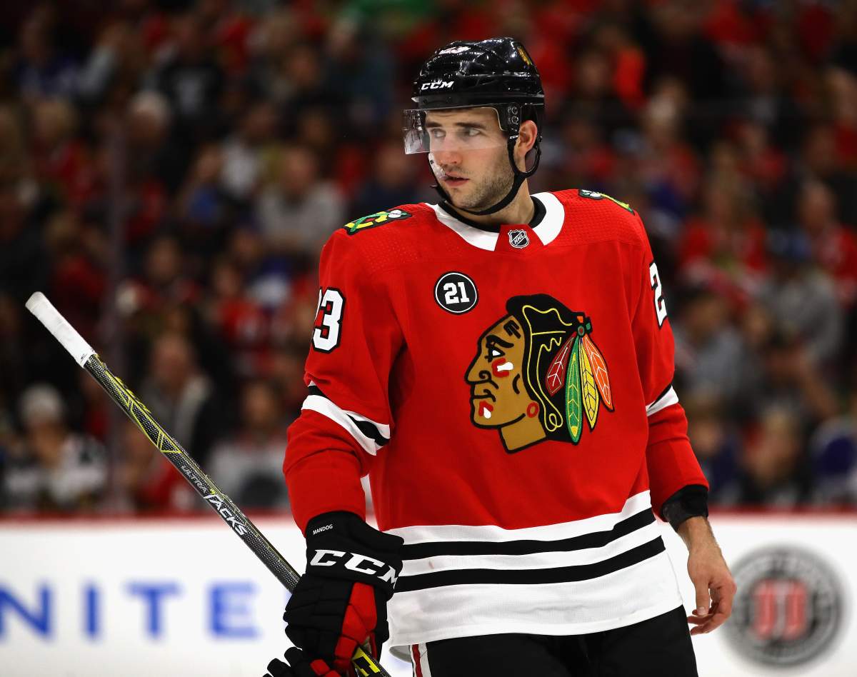 Brandon Manning #23 of the Chicago Blackhawks awaits a face off against the Toronto Maple Leafs during the regular season opening home game at the United Center on October 7, 2018 in Chicago, Illinois. The Maple Leafs defeated the Blackhawks 7-6 in overtime.  