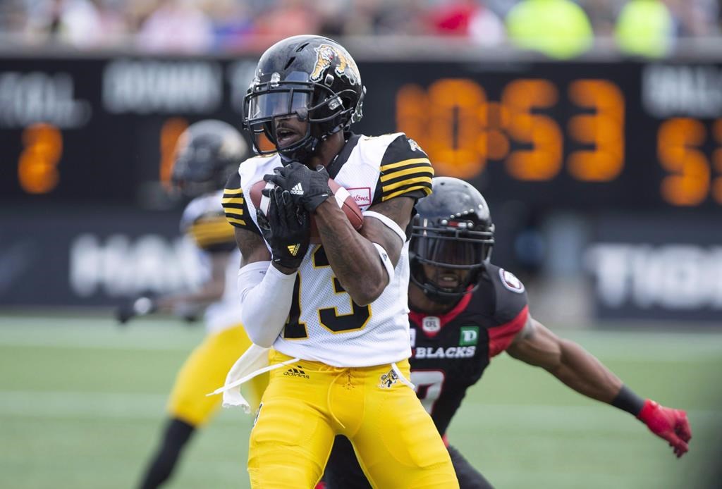 Hamilton Tiger-Cats wide receiver Jalen Saunders (13) makes a catch during first half CFL football game action against the Ottawa Redblacks in Hamilton, Ont. on Saturday, July 28, 2018. The Tiger-Cats have re-signed international wide receiver Saunders.
