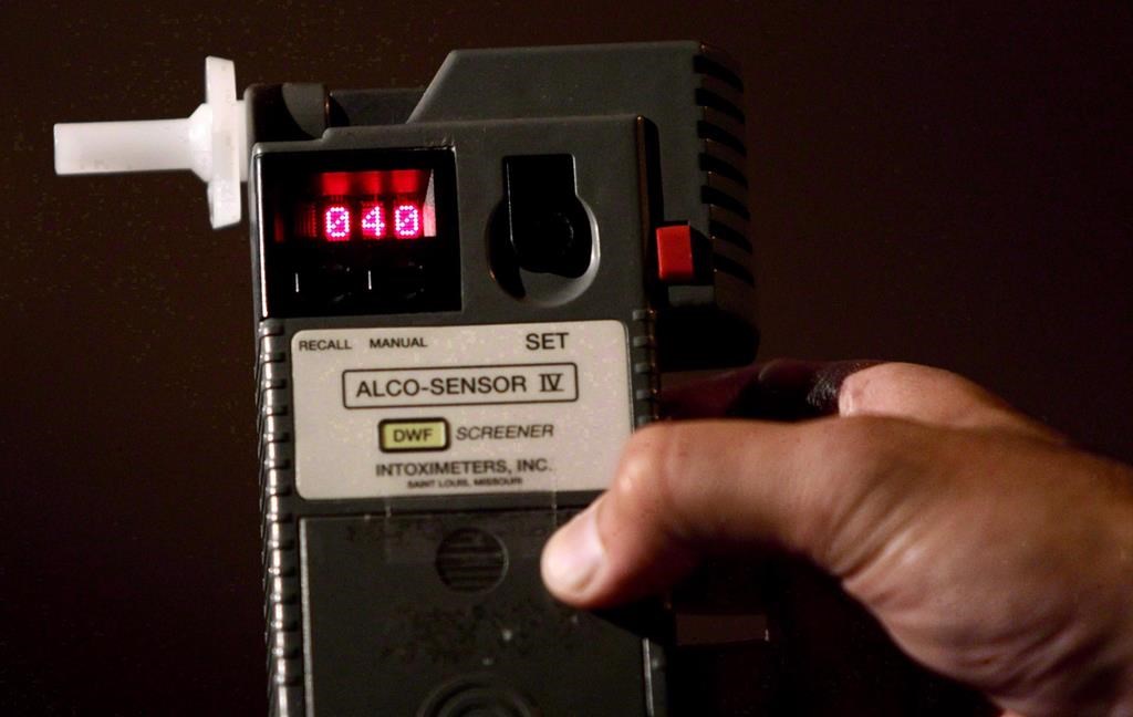 An RCMP Constable holds a breathalyzer test in Surrey, B.C., in this September 24, 2010 photo.