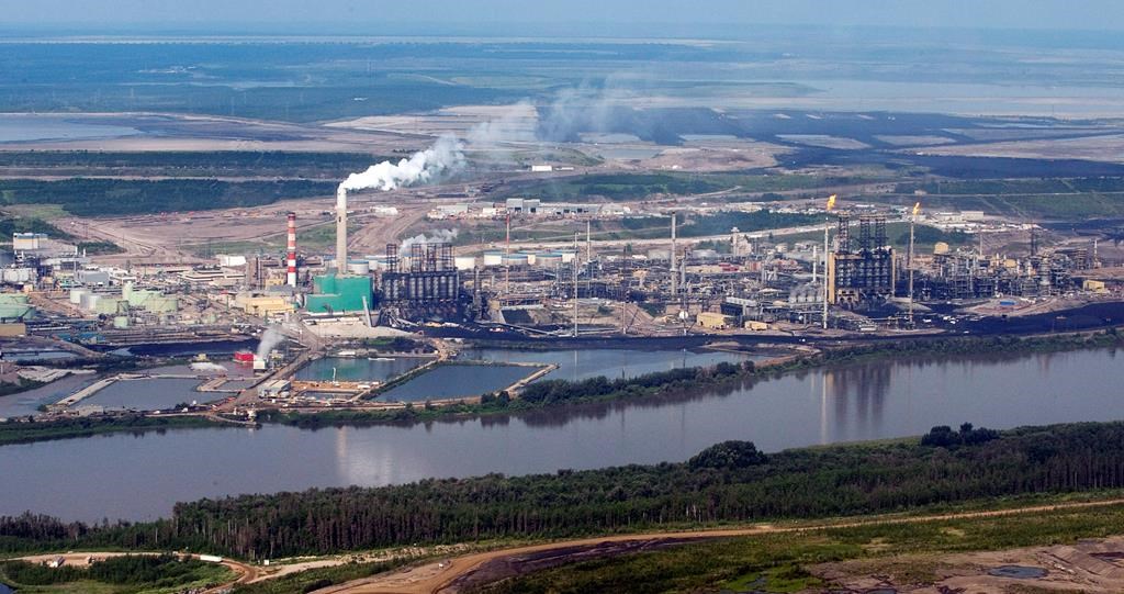 The Suncor mine facility along the Athabasca river as seen from a helicopter tour of the oil sands near Fort McMurray, Alta., Tuesday, July 10, 2012.