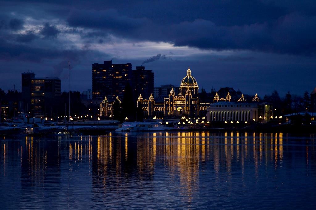 The British Columbia Legislature is reflected in the waters of Victoria harbour in the early morning in Victoria, B.C. Monday, Jan. 16, 2012.