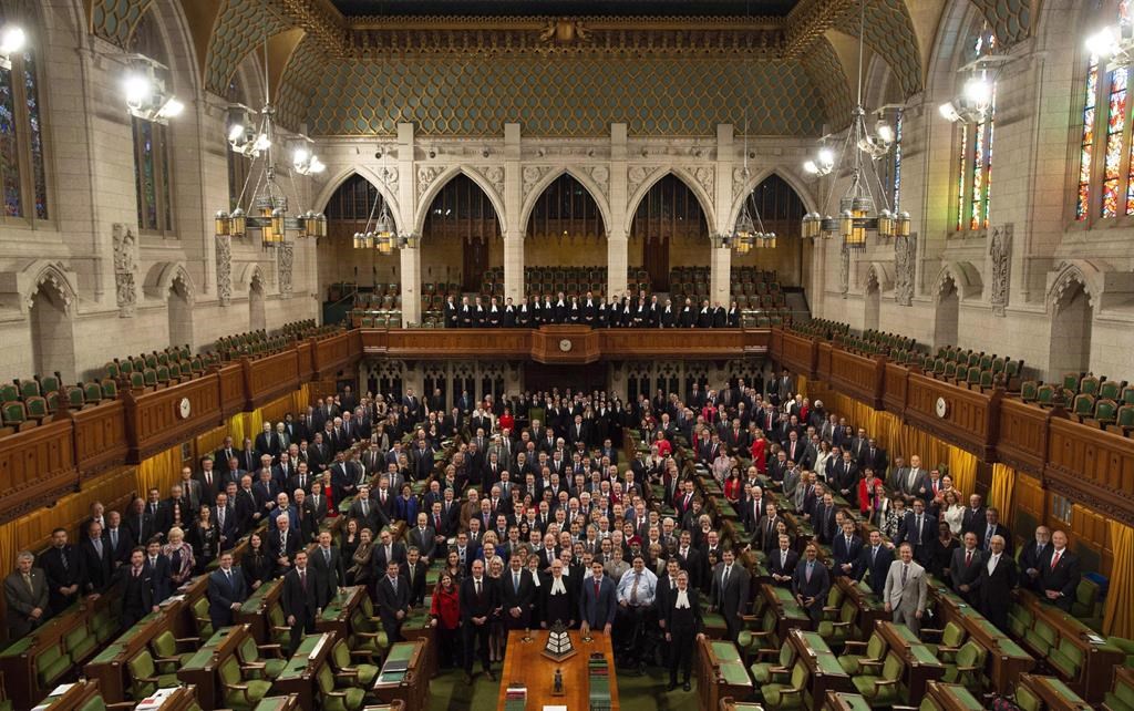Members of the House of Commons pose for a photo in the chamber before Question Period in the House of Commons Wednesday, December 12, 2018 in Ottawa. Centre block is slated to close for renovations following the fall session.