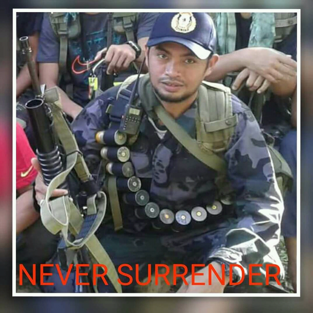 Facebook photo believed to show Abu Sayyaf militant Bhen Tatuh wearing a Philippine National Police uniform.