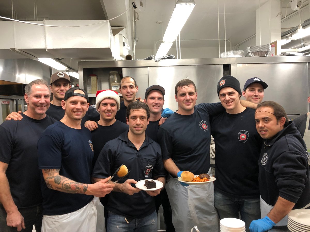 Montreal firefighters at the Welcome Hall Mission cooked and served warm meals to the homeless during the holiday season on Thursday, Dec. 13, 2018.