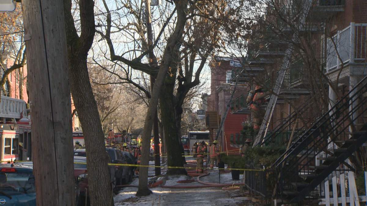 Montreal firefighters tackle a four-alarm fire on Sicard Street. Saturday, Dec. 15, 2018.