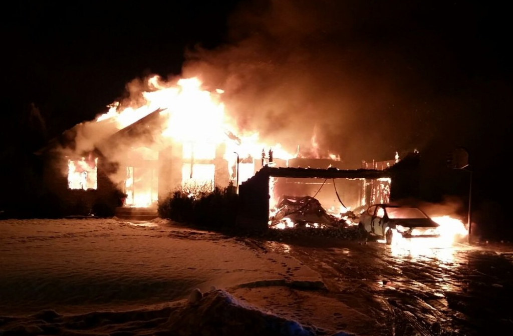 The house and garage were completely engulfed in flames.