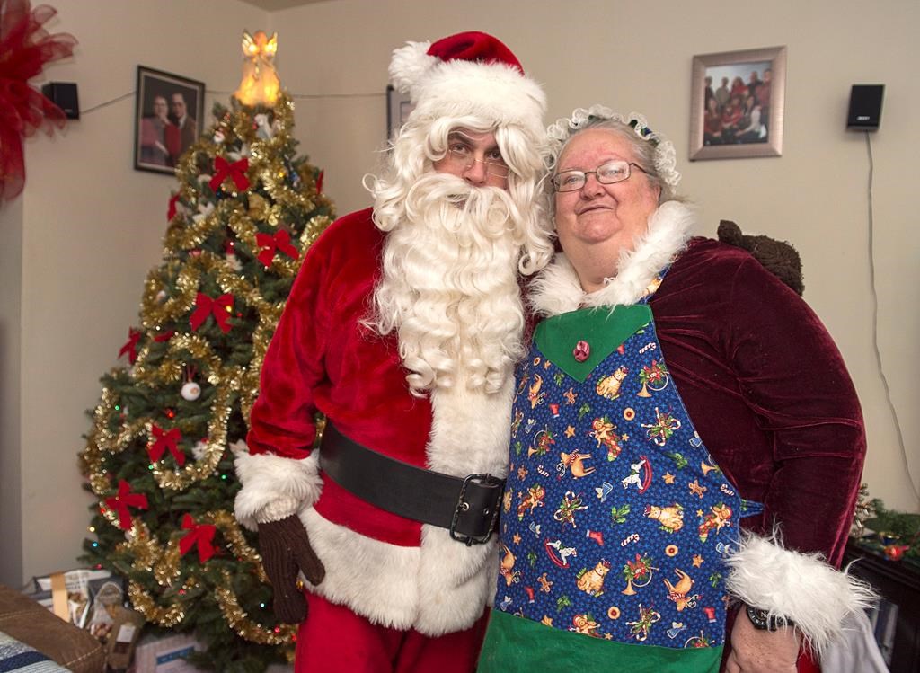 Ted Carroll, a Santa-for-hire, and his wife Kim, as Mrs. Claus, display their outfits in Halifax on Dec. 17, 2018. Professional Santas and their associates across the country are into the busy season as Christmas draws closer.