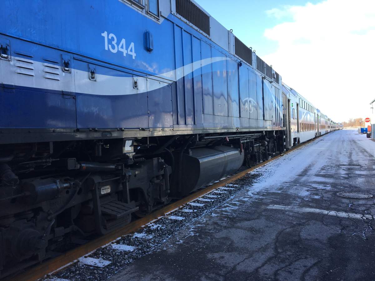 A 74-year-old man taking a road test was killed Tuesday and his passenger — an employee of Quebec's motor vehicle insurance agency — was critically injured after the car they were in collided with a commuter train.