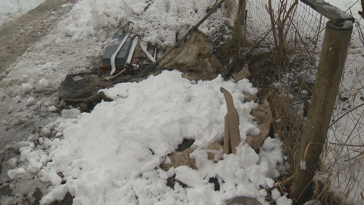 The snow-covered remnants of a plastic outhouse fire that occurred in a Kelowna alley on Saturday morning.