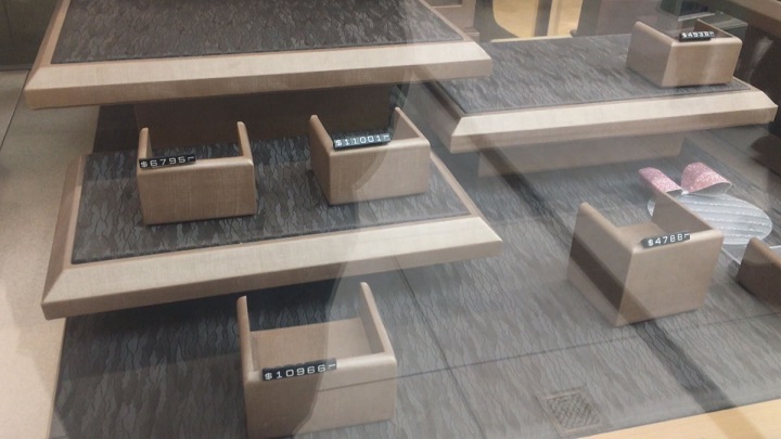 Empty display boxes can be seen inside the jewelry store.