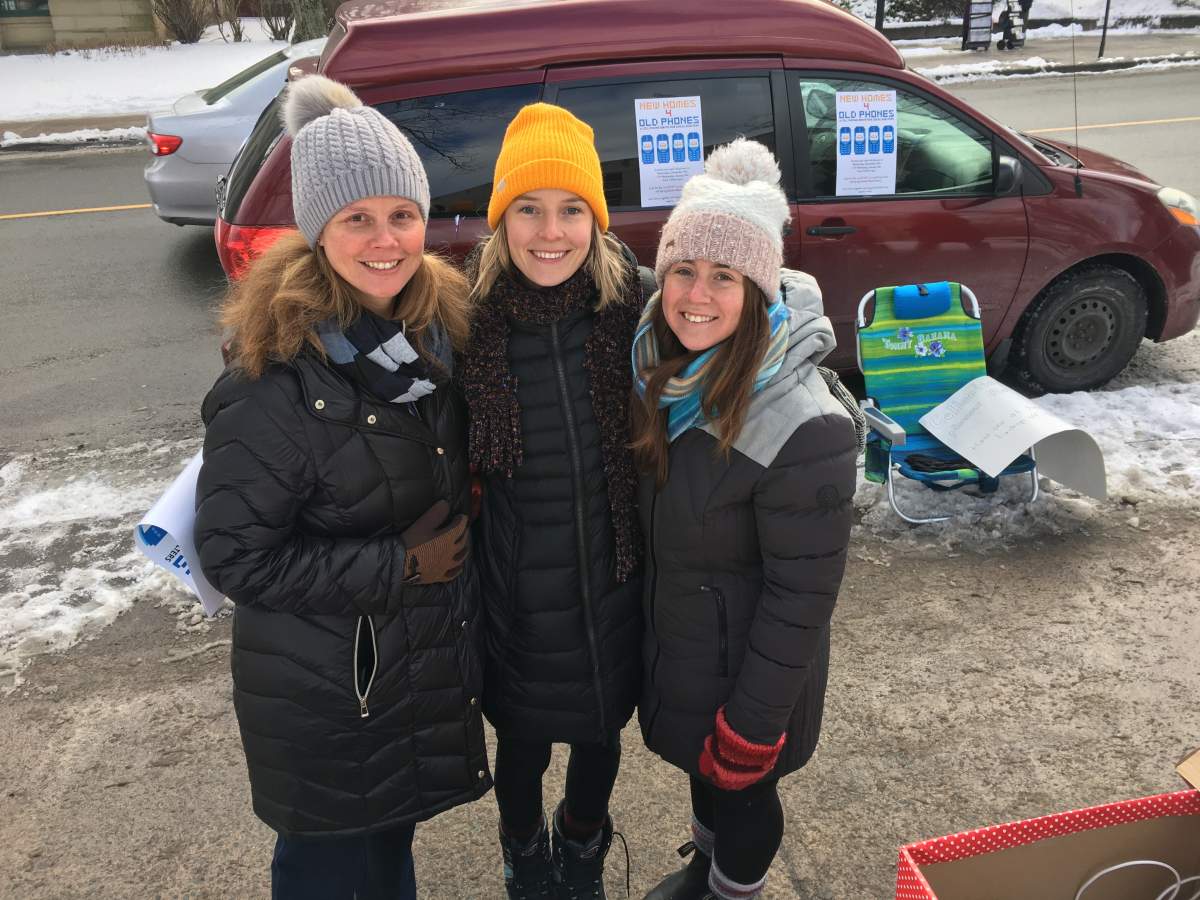 Members and volunteers with the Mobile Outreach Street Health team collect old cellphones to help support those in need of housing and healthcare services.