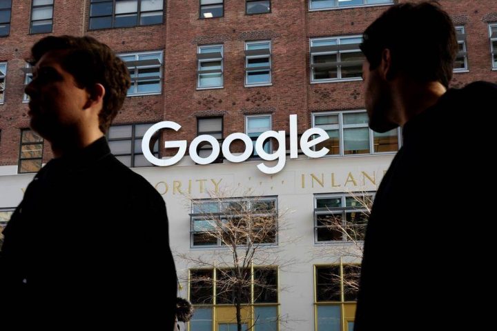 In this Dec. 4, 2017, file photo, people walk by Google offices in New York.
