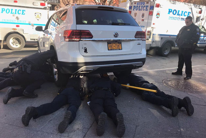 Some of New York City’s finest jumped to action on Tuesday to rescue a kitten that was stuck under an SUV.