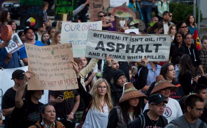 Protesters march during a rally held to show opposition to the Enbridge Northern Gateway pipeline in Vancouver, B.C., on June 17, 2014. 