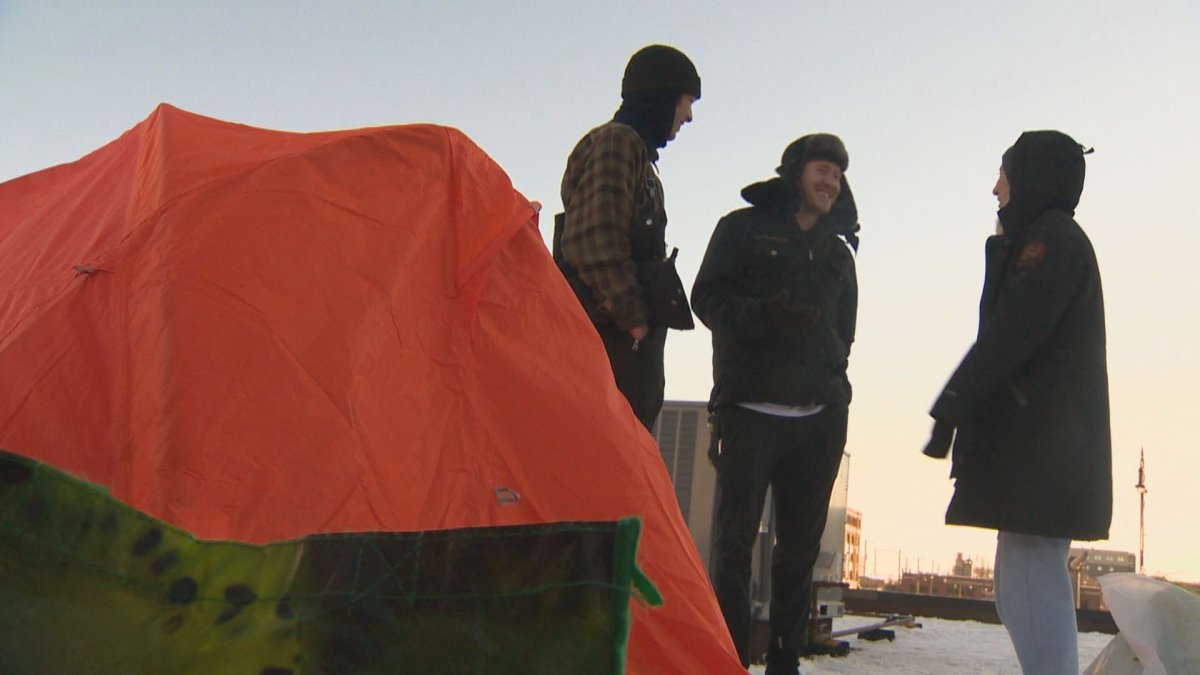 Local Businesses camp out on rooftop to raise awareness for the homeless.