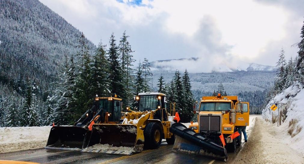 FILE - Snow clearing plows waiting for work on the Trans Canada Highway. Environment Canada said a cold front will pass through the Coquihalla summit on Tuesday afternoon and produce a round of flurries, at times heavy.