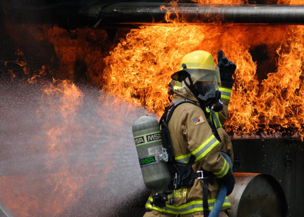 A firefighter battles a fire.
