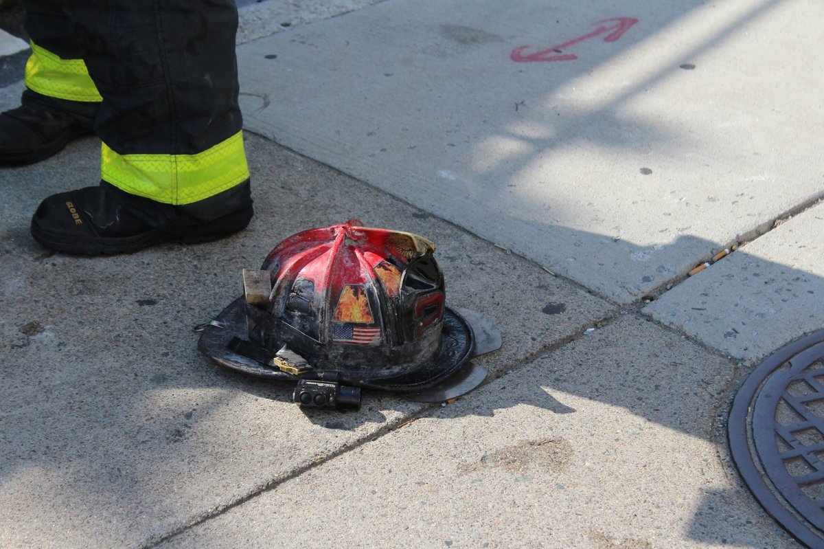 A charred firefighting helmet.