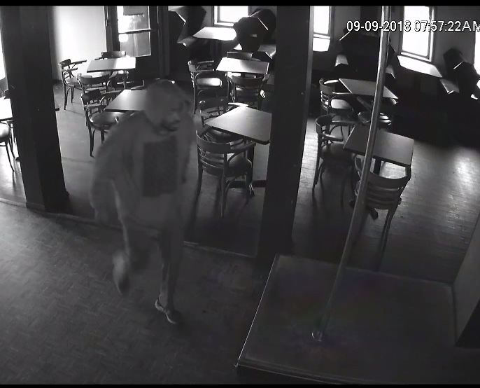Hamilton Police have released a surveillance photo of a man who allegedly robbed the Happy Hourz Pub. 