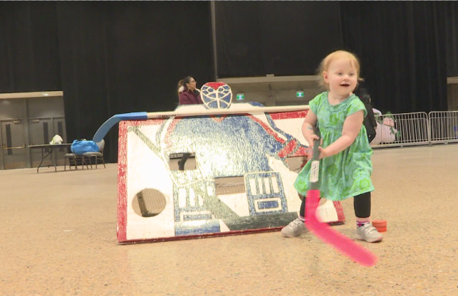 Hilarie Zamkotowich (3) enjoying a game of floor hockey at the annual “Holiday Carnival for Kidz”.