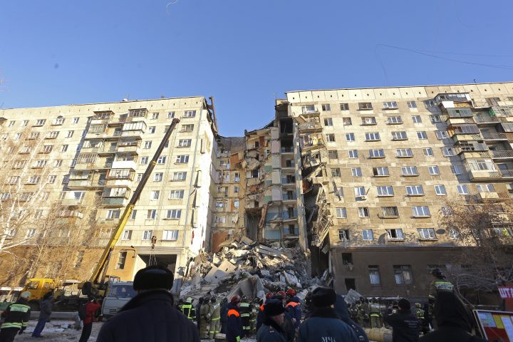 Emergency Situations employees working at the scene of a collapsed apartment building in Magnitogorsk, Russia, Monday, Dec. 31, 2018.