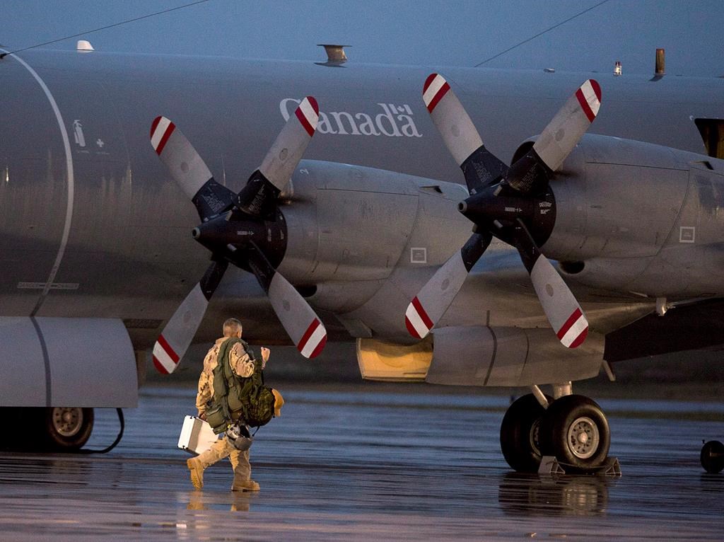 FILE - A CP-140M Aurora reconnaissance aircraft prepares to leave CFB Greenwood in Nova Scotia's Annapolis Valley on Friday, October 24, 2014.