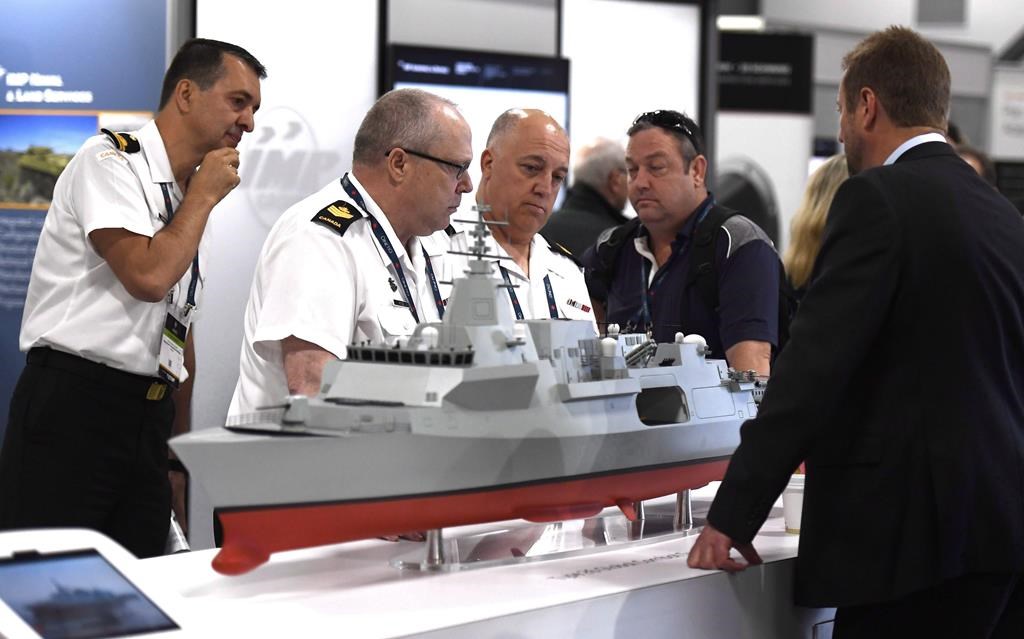 People surround a BAE Systems Type 26 Global Combat Ship at the Canadian Association of Defence and Security Industries CANSEC trade show in Ottawa in 2018. The new Canadian River-class destroyer will use this design.