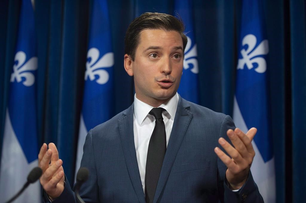 Coalition Avenir Québec MNA Simon Jolin-Barrette responds to reporters' questions on Tuesday, Oct. 9, 2018 at the legislature in Quebec City.