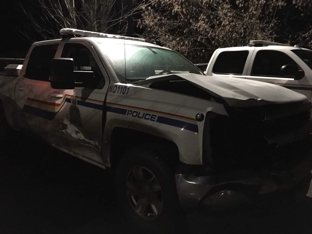 A damaged RCMP SUV sits outside the Enderby police office Monday. It was struck by a suspect vehicle, according to RCMP.