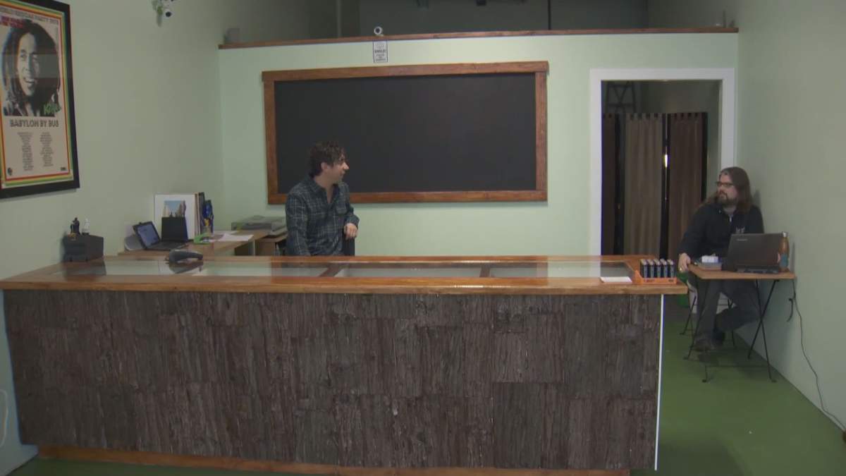 Mike Babins sits inside the Evergreen Cannabis Society. The shop is set to open with Vancouver\’s first cannabis retail licence on Saturday.