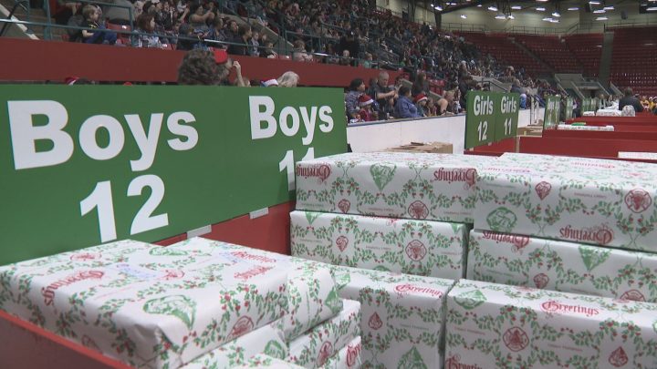 Thousands of children received gifts at the 51st annual Calgary Firefighters Toy Association Christmas party at the Stampede Corral on Sunday.