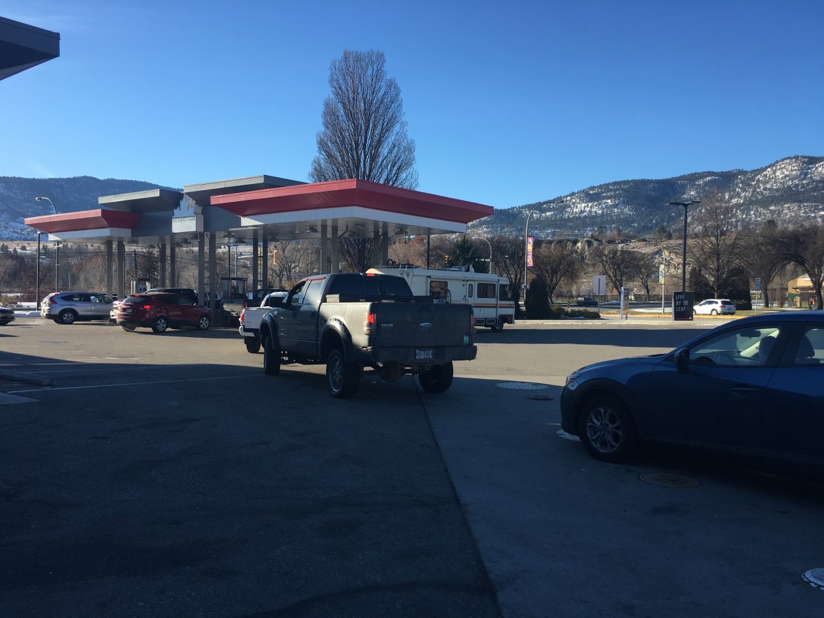 Vehicles line up for fuel at a gas station in Penticton where prices have dropped below a dollar. 