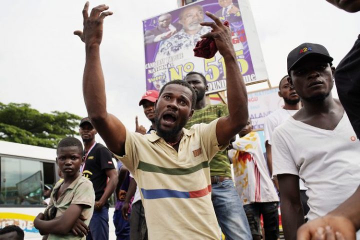 Congolese supporters of opposition candidate Martin Fayulu protest the cancellation of their rally in Kinshasa, Democratic Republic of the Congo, Wednesday Dec. 19, 2018.