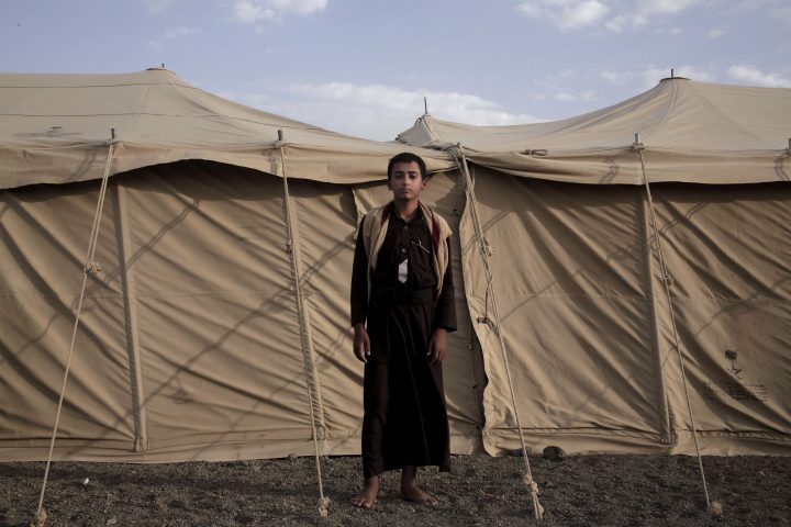 Sadek, a 14 year-old former child soldier, poses for a photograph at a camp for displaced persons where he took shelter with his family, in Marib, Yemen, in this July 27, 2018, photo.