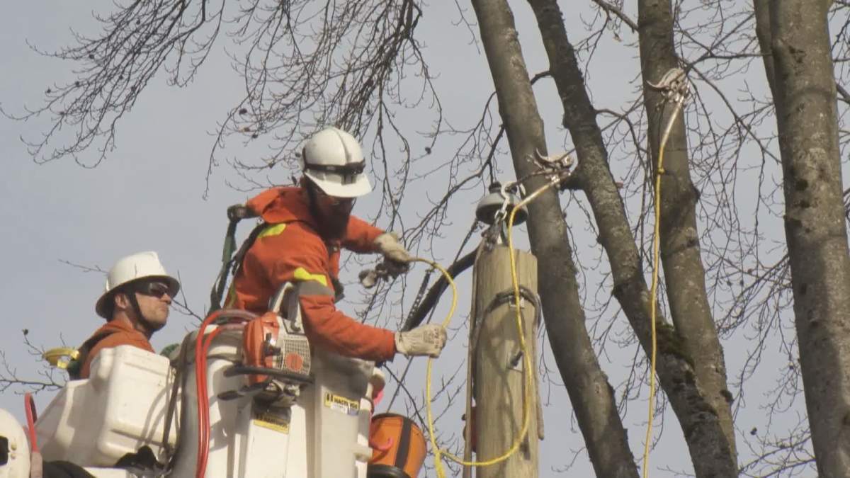 BC Hydro crews work to restore power after a windstorm in December 2018.