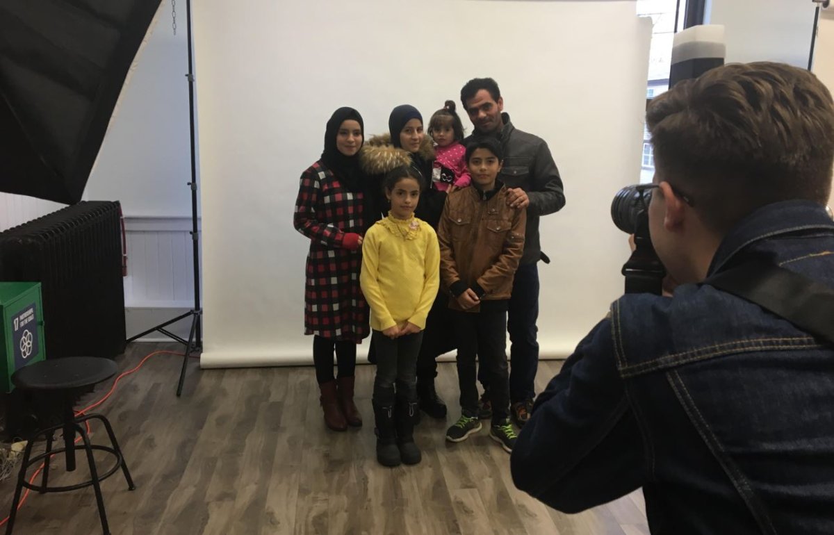 An immigrant family has their picture taken at Common Good Solutions in Halifax on Saturday, Dec. 1, 2018. 
