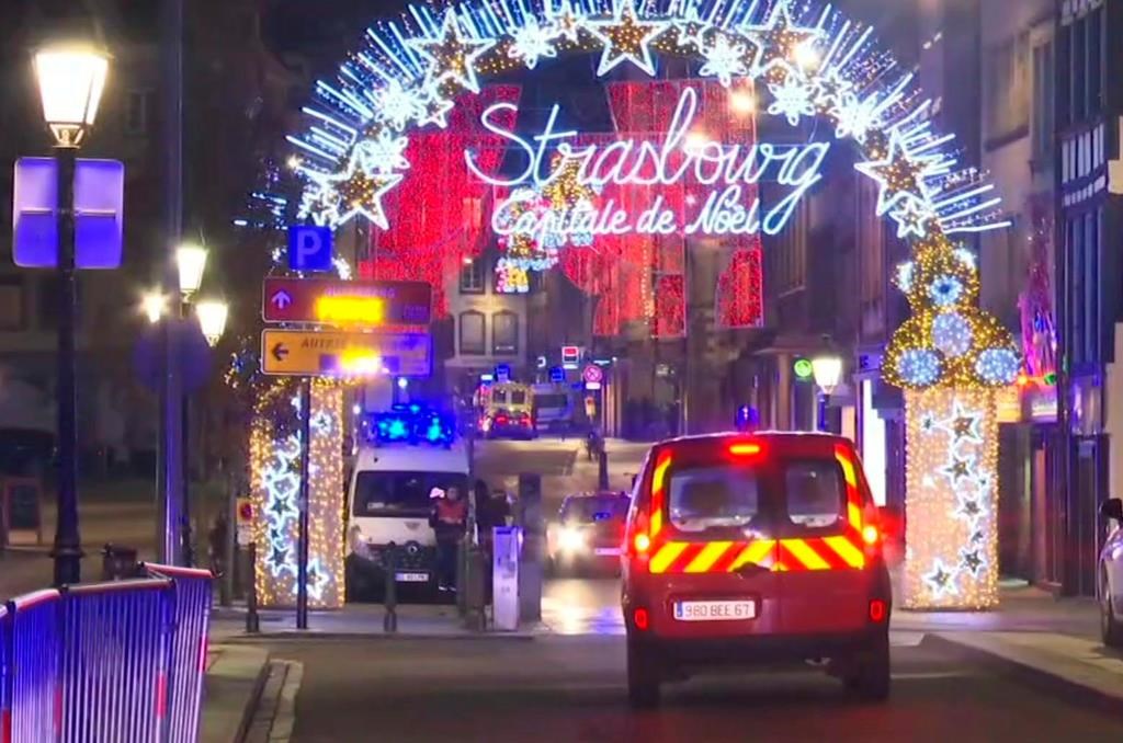 In this image made from video, emergency services arrive on the scene of a Christmas market in Strasbourg, France, Tuesday, Dec. 11, 2018.